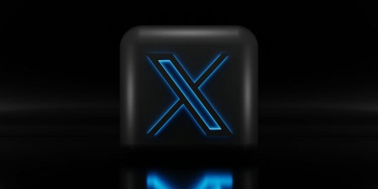 a blue illuminated letter x on a black background