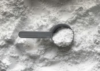 black magnifying glass on white and brown marble table
